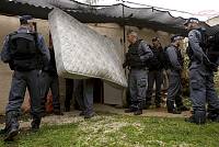 Furniture is removed from an apartment by workers surrounded by police officers during the eviction of residents from the Kfar Shalem neighborhood of Tel Aviv, December 2007.<br>Oren Ziv/activestills.org<br><br>