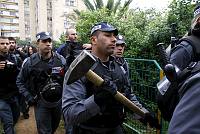Police officers from the Special Patrol Unit break into a compound in the Kfar Shalem neighborhood of Tel Aviv to evict dozens of families of who have lived there since 1949, December 2007. The eviction took place after a contractor bought land in the neighborhood to build luxury apartments. <br>Yotam Ronen/activestills.org<br>