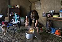 A homeless single mother prepares food for her friends at a protest encampment against unfair housing policies, Jerusalem, June 2007.<br>Oren Ziv/activestills.org<br><br><br><br>