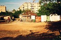 A new building overshadows low-income apartment blocks in south Tel Aviv, February 2008. The photo is part of a project called &quotAsylum City", in which young Sudanese refugees describe their experiences through photos, in cooperation with ActiveVision