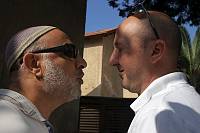 Housing rights activist Haim Bar Yaakov confronts a construction contractor who arrived to evict a family from their home because they were late in making their mortgage payments, Gan Yavne, October 2007<br>Meged Gozani/activestills.org<br>