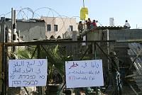 Social activists and local residents blockade themselves into the Saba'a family's home in the Ajami neighborhood of Jaffa in an attempt to prevent the Amidar public housing company from evicting them, March 2007<br>Oren Ziv/activestills.org<br>