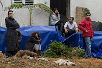 The Balassi family sits in their yard after being evicted from their home in the Kfar Shalem neighborhood of Tel Aviv, December 2007.<br>Nir Landau/activestills.org<br><br><br><br>