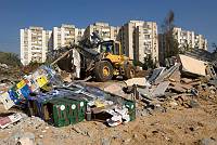 A bulldozer removes the remains of a demolished home in the Kfar Shalem neighborhood of Tel Aviv, after residents had been evicted, December 2007.<br>Nir Landau/activestills.org<br><br><br><br><br><br>